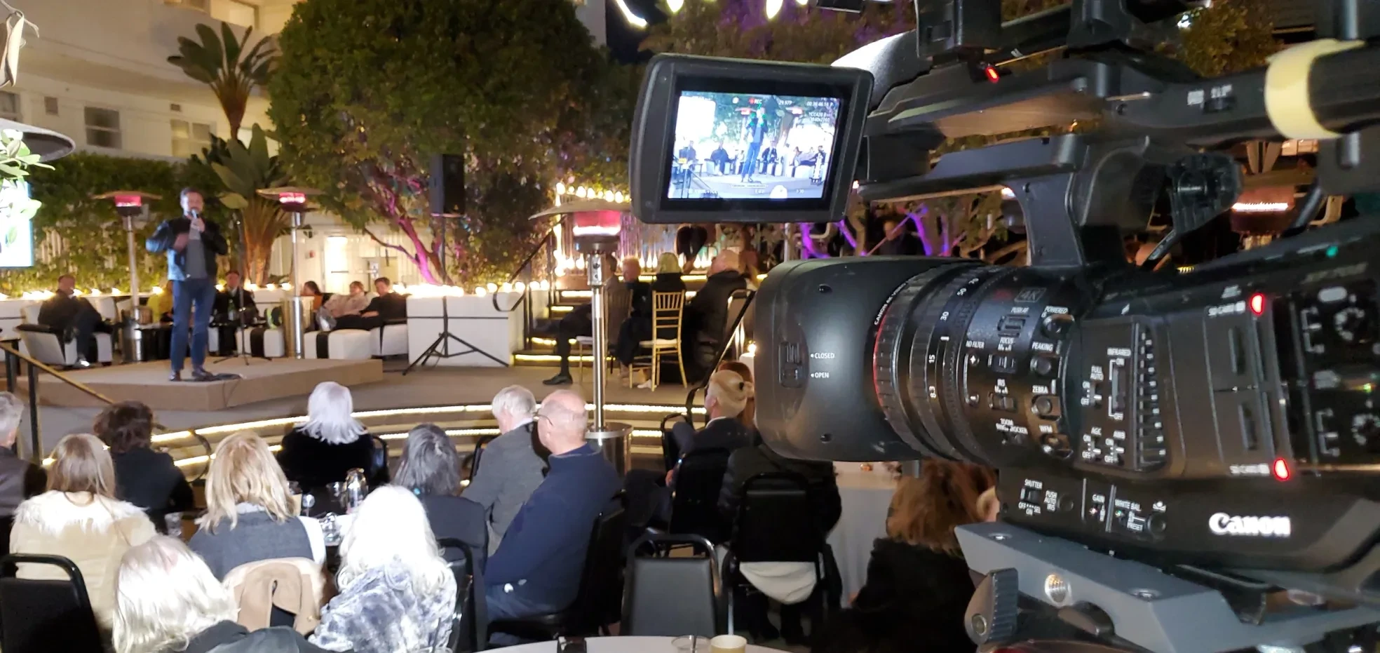 FCM camera operator at outdoor evening event