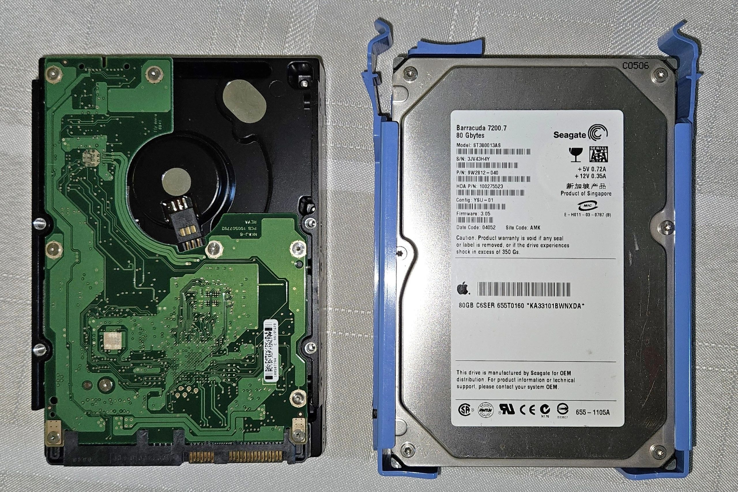 Two 3.5-inch hard drives, one showing the circuit board and the other with the label visible.